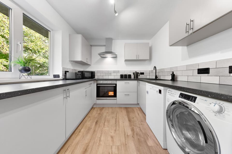 Kitchen or kitchenette, dishwasher, stove, washing machine, dryer