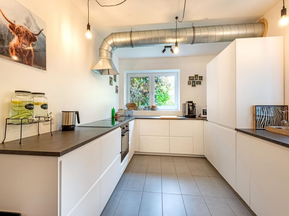 Kitchen or kitchenette, dishwasher, oven, stove
