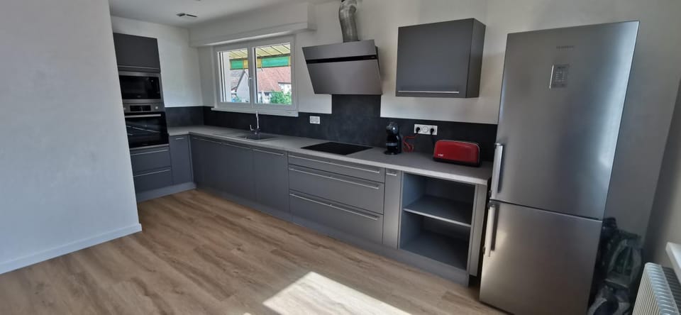 Kitchen or kitchenette, dishwasher, oven, stove