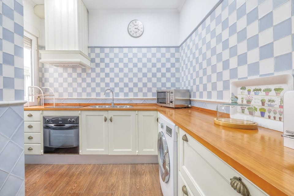 Kitchen or kitchenette, dishwasher, microwave, oven, stove