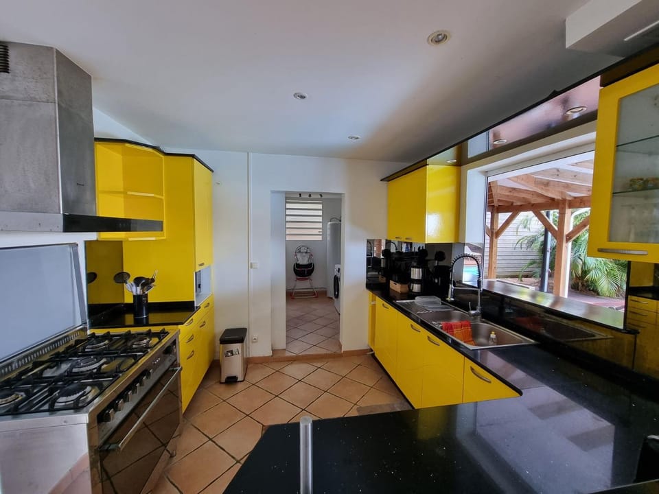 Kitchen or kitchenette, dishwasher, oven, stove