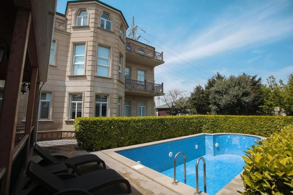 Property building, Pool view, Swimming pool, sunbed