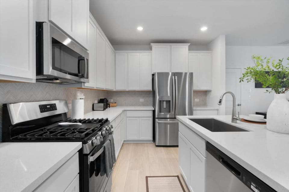 Kitchen or kitchenette, dishwasher, oven, stove, toaster