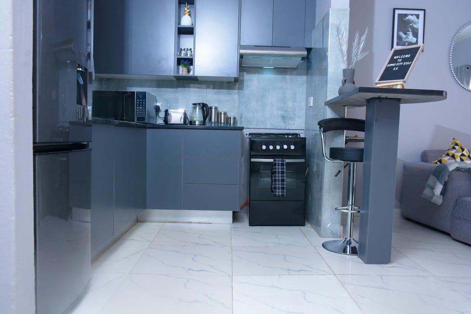 Kitchen or kitchenette, microwave, oven, stove