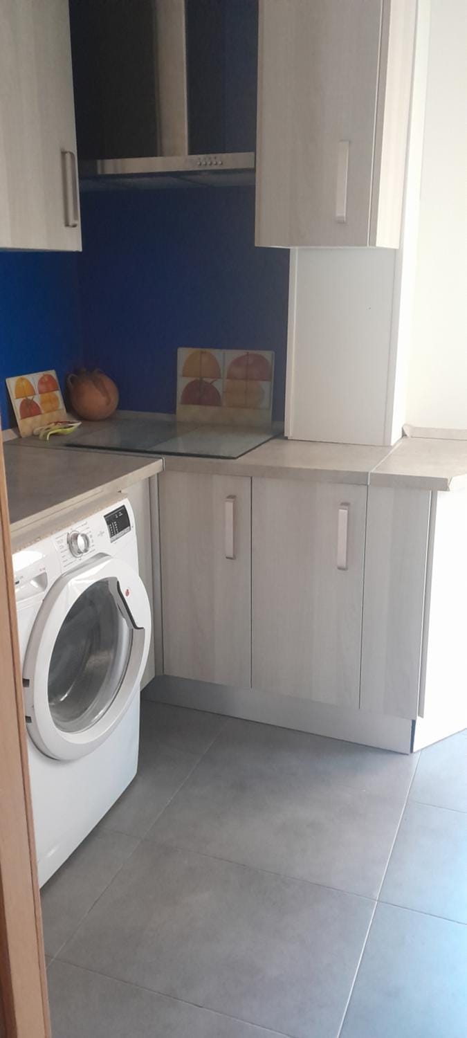 Kitchen or kitchenette, washing machine
