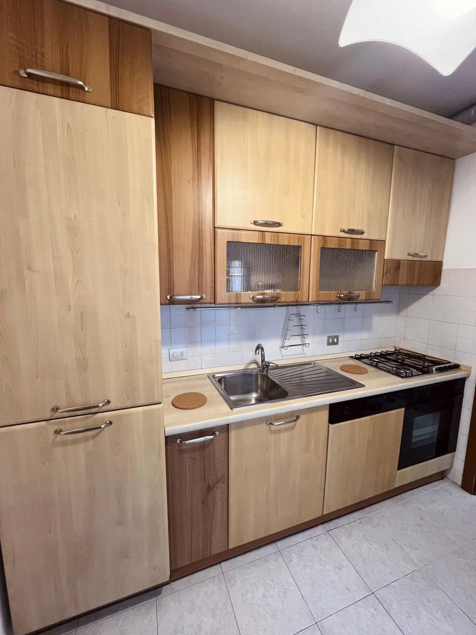 Kitchen or kitchenette, dishwasher, oven, stove