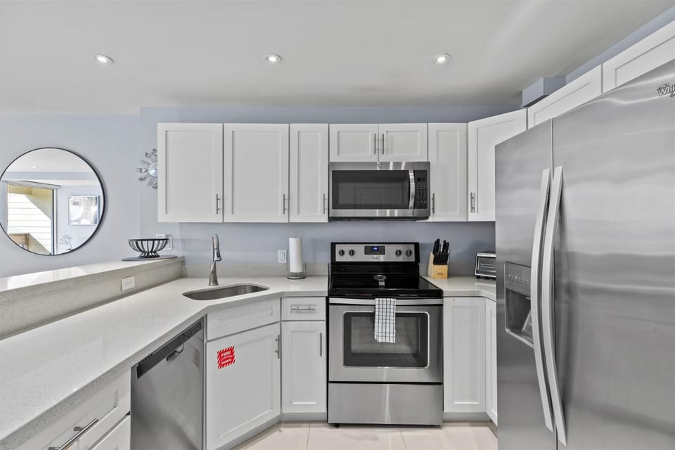 Kitchen or kitchenette, dishwasher, oven, stove
