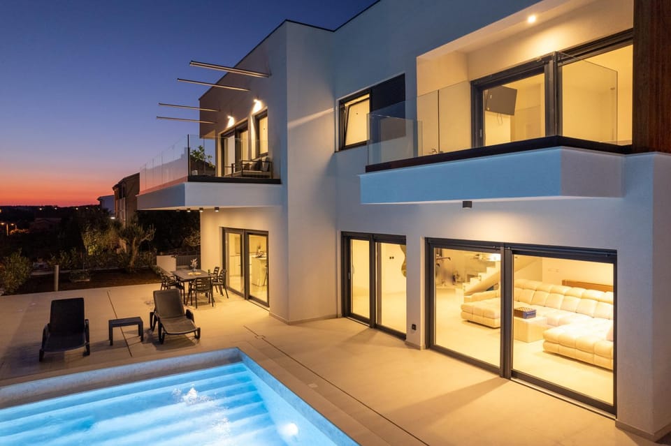 Property building, Night, Swimming pool, Swimming pool, sunbed