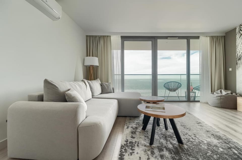 Living room, Seating area, Sea view, air conditioner