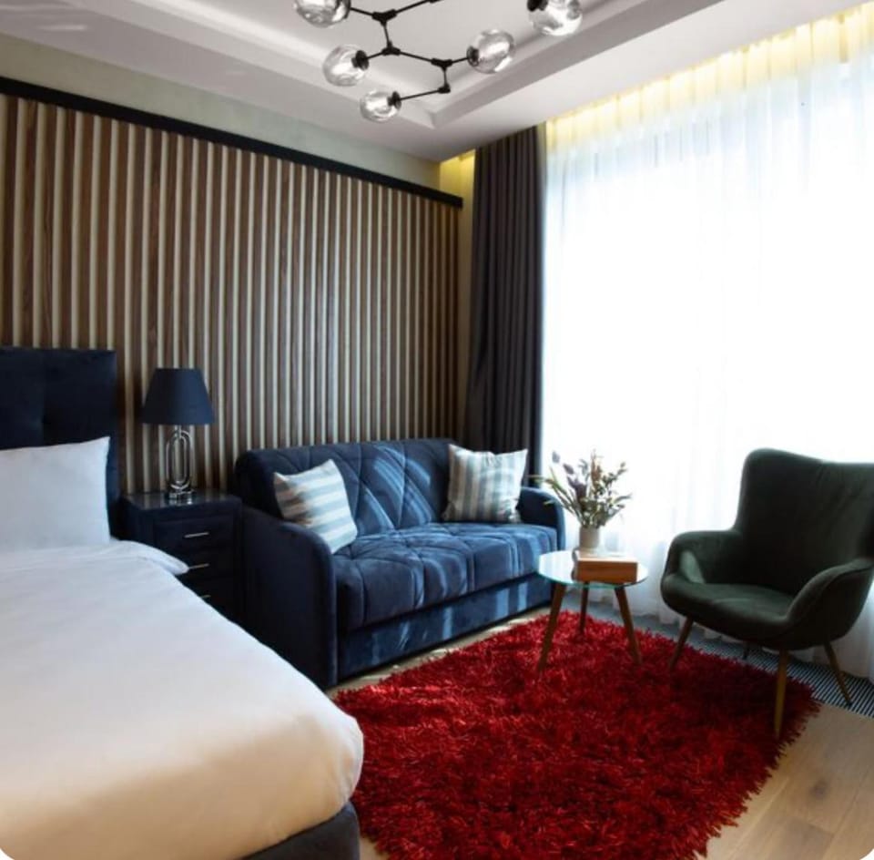 Bed, Living room, Seating area, Bedroom