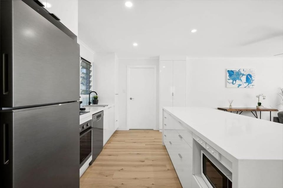 Kitchen or kitchenette, dishwasher, oven, stove