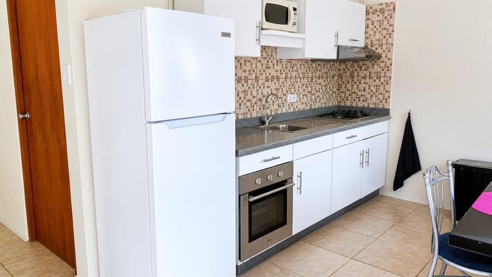 Kitchen or kitchenette, microwave, oven, stove, kitchen