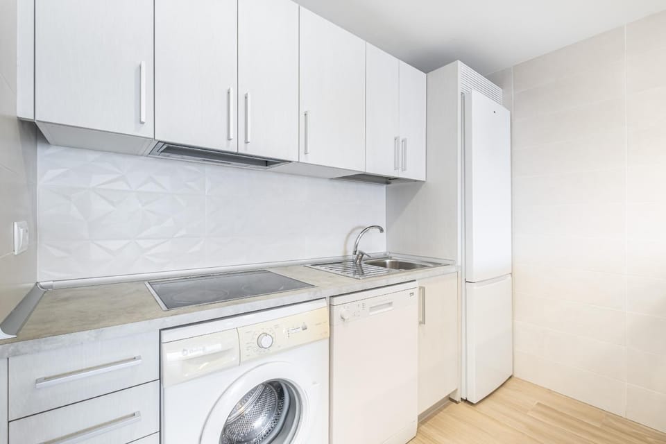 Kitchen or kitchenette, dishwasher, stove, washing machine