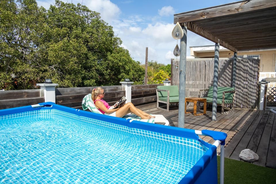 Property building, Patio, Day, Summer, Balcony/Terrace, Other, Seating area, Garden view, Pool view, Swimming pool, sunbed