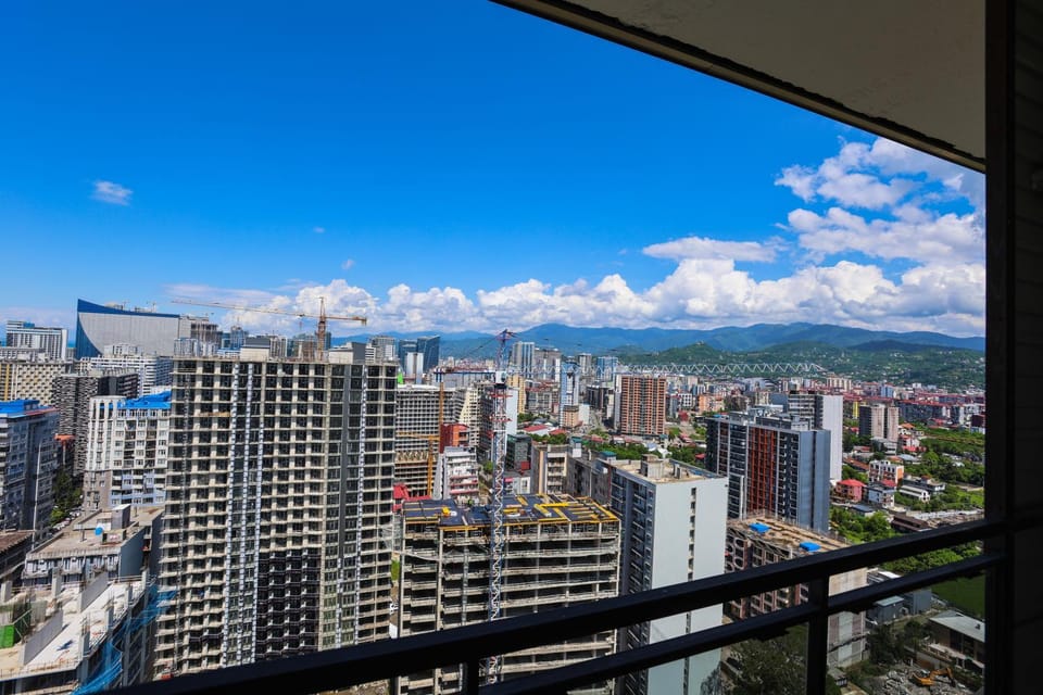 Property building, Nearby landmark, Day, Natural landscape, Bird's eye view, City view, Mountain view