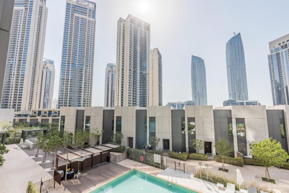 10 minutes to Airport 2BR Creek Harbour with Pool Ideal for Transit and Families Apartment in Dubai