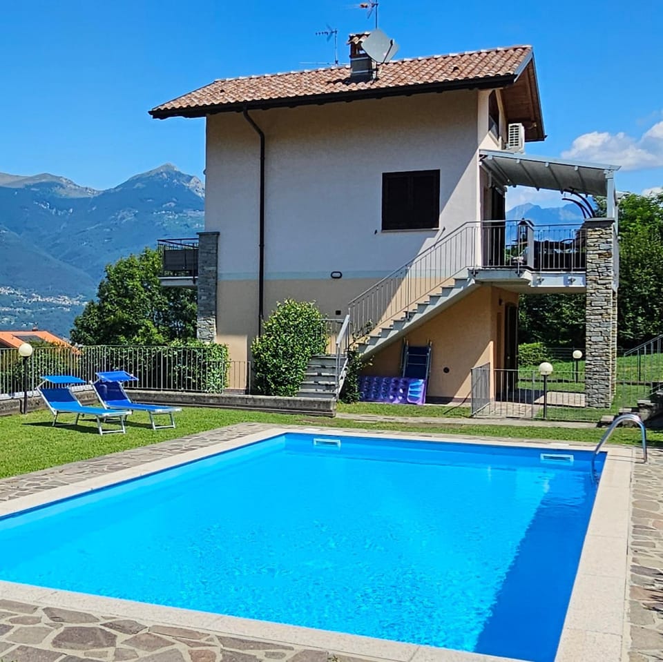 Property building, Day, Natural landscape, Mountain view, Pool view, Swimming pool, sunbed
