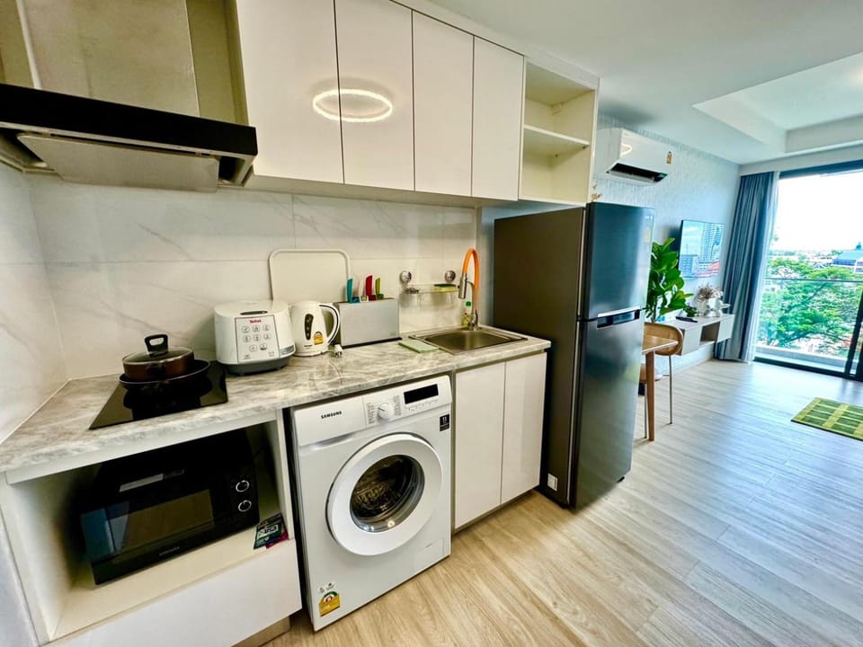 Kitchen or kitchenette, microwave, stove, washing machine