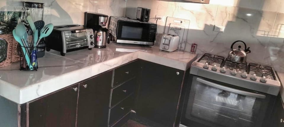Kitchen or kitchenette, oven, toaster