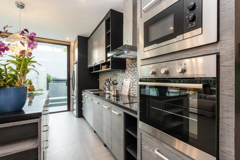 Kitchen or kitchenette, dishwasher, oven, stove, toaster