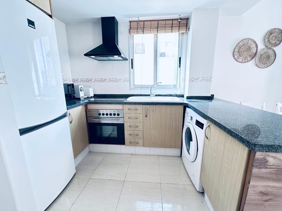 Kitchen or kitchenette, toaster, washing machine