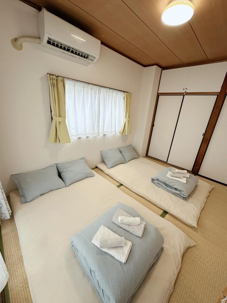 Bed, Photo of the whole room, Bedroom, storage, towels, air conditioner