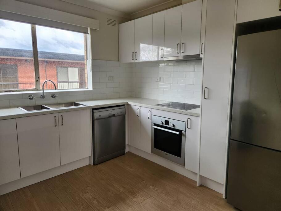 Kitchen or kitchenette, dishwasher, oven, stove