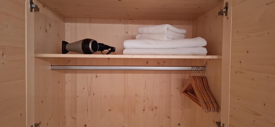 hair dryier, towels, wardrobe