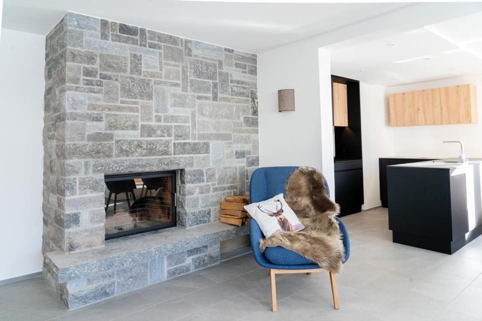 Seating area, fireplace, kitchen