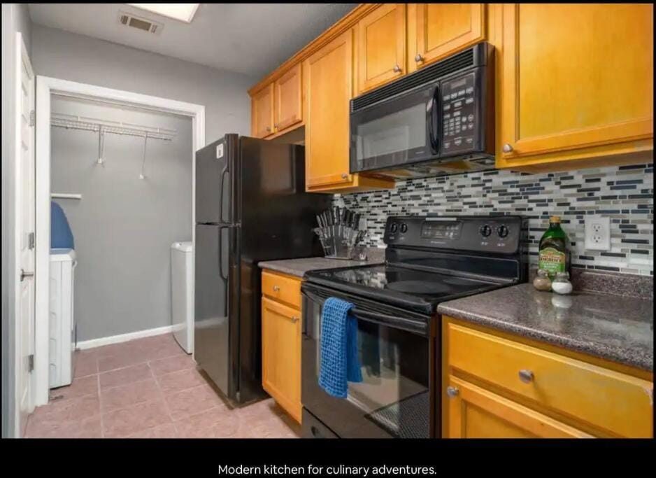 Kitchen or kitchenette, microwave, stove, laundry