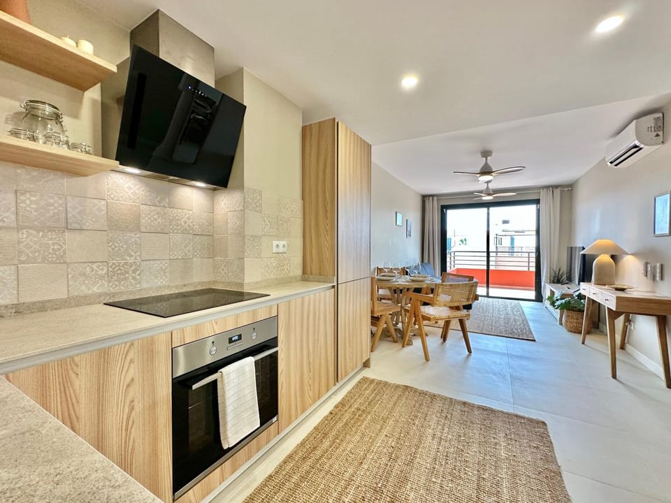 Living room, Dining area, oven, stove, kitchen, air conditioner