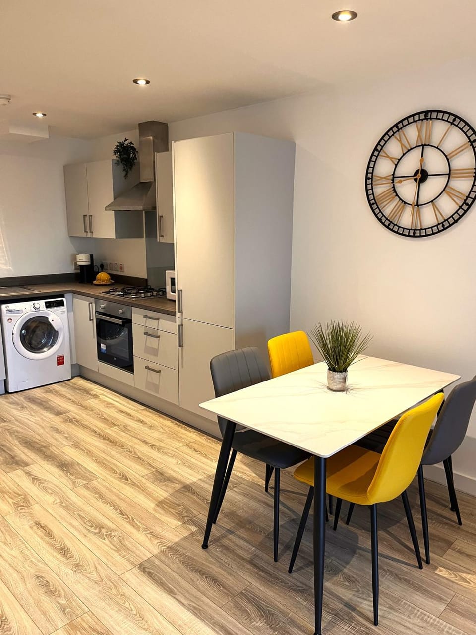 Kitchen or kitchenette, oven, stove, washing machine