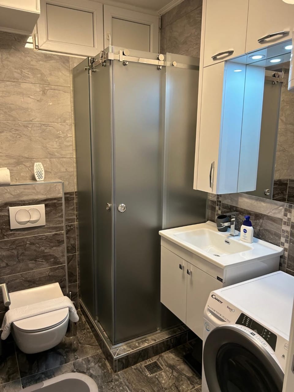 Shower, Toilet, Bathroom, towels, washing machine, dryer