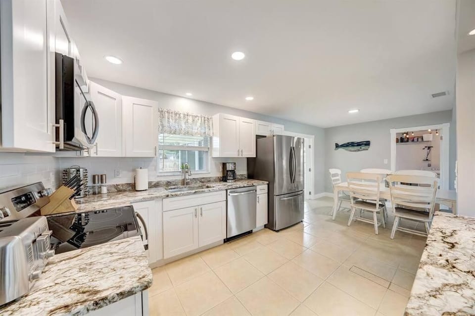 Kitchen or kitchenette, dishwasher, oven, stove