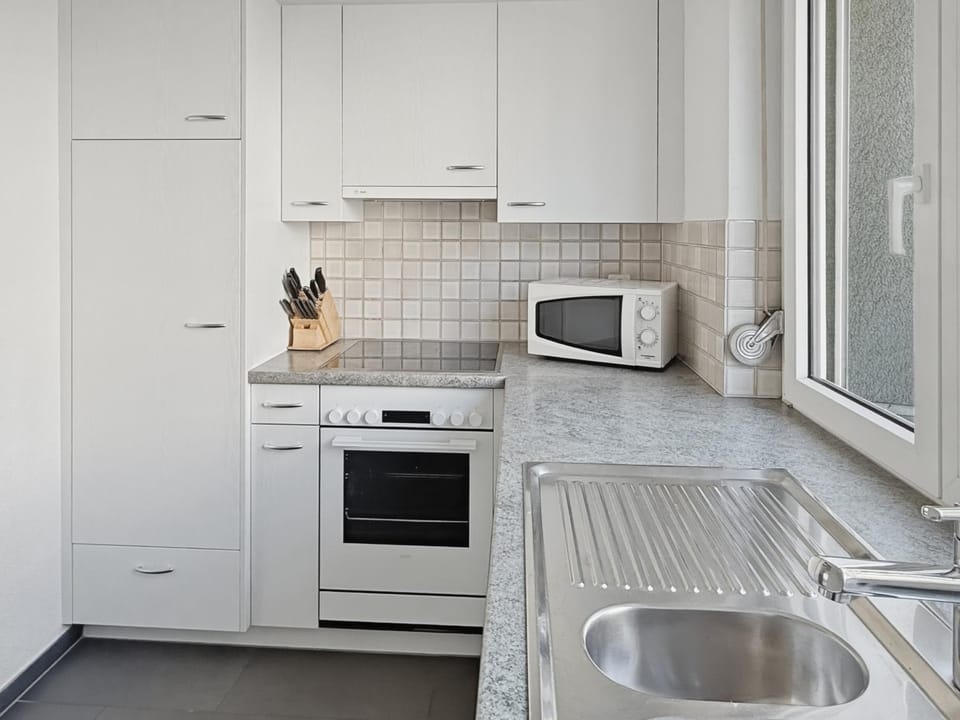 Kitchen or kitchenette, microwave, oven, stove, kitchen