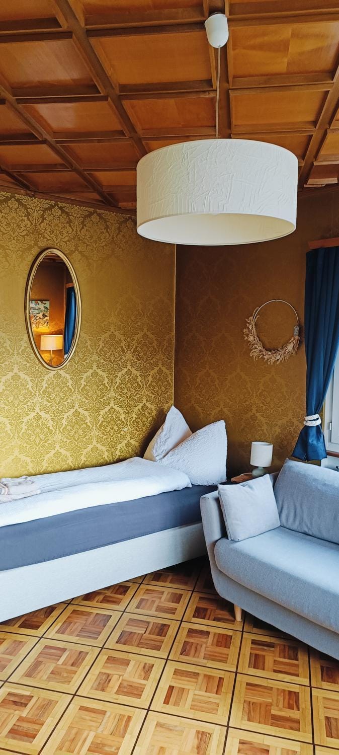 Bed, Living room, Seating area, Bedroom