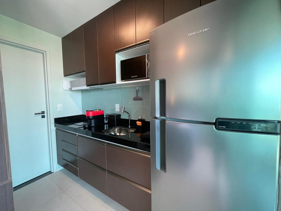 Kitchen or kitchenette, dishwasher, oven, stove