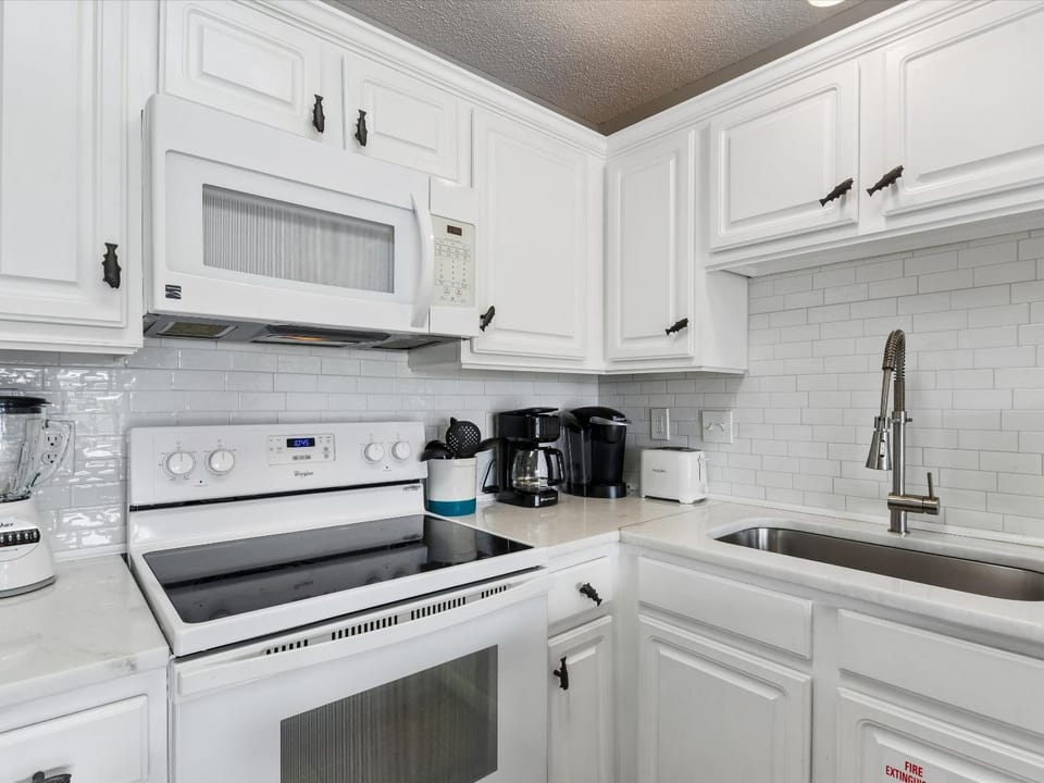Kitchen or kitchenette, furniture, microwave, oven, stove, toaster, kitchen