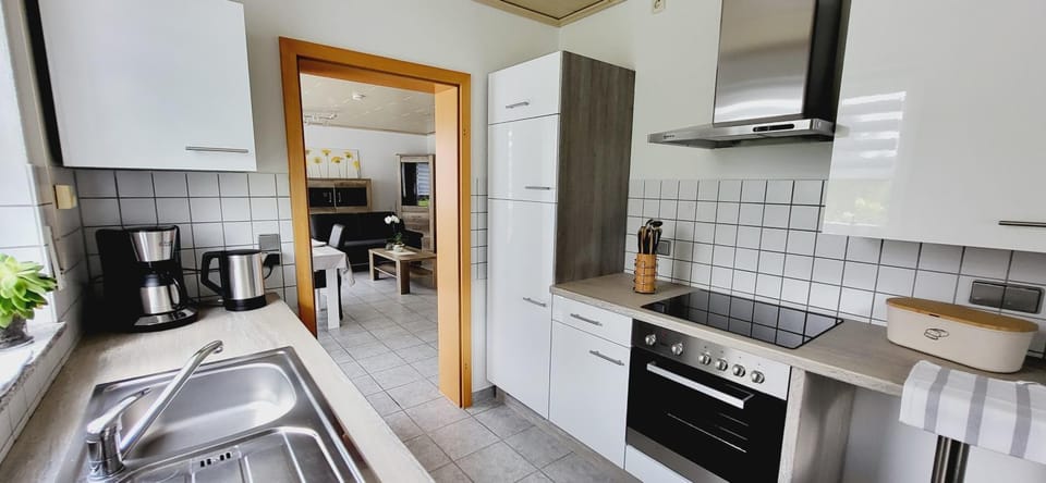 Kitchen or kitchenette, dishwasher, oven, stove