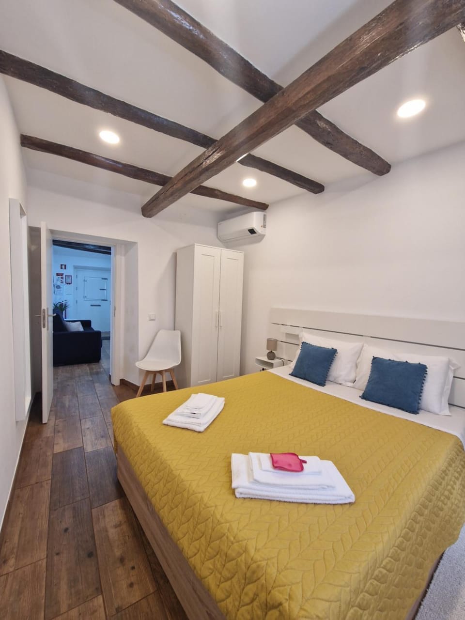 Bed, Bedroom, towels, wardrobe, air conditioner