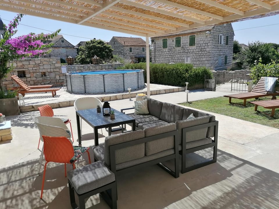 Property building, Patio, Day, Garden, View (from property/room), Balcony/Terrace, Seating area, Dining area, Garden view, Pool view, Swimming pool, sunbed