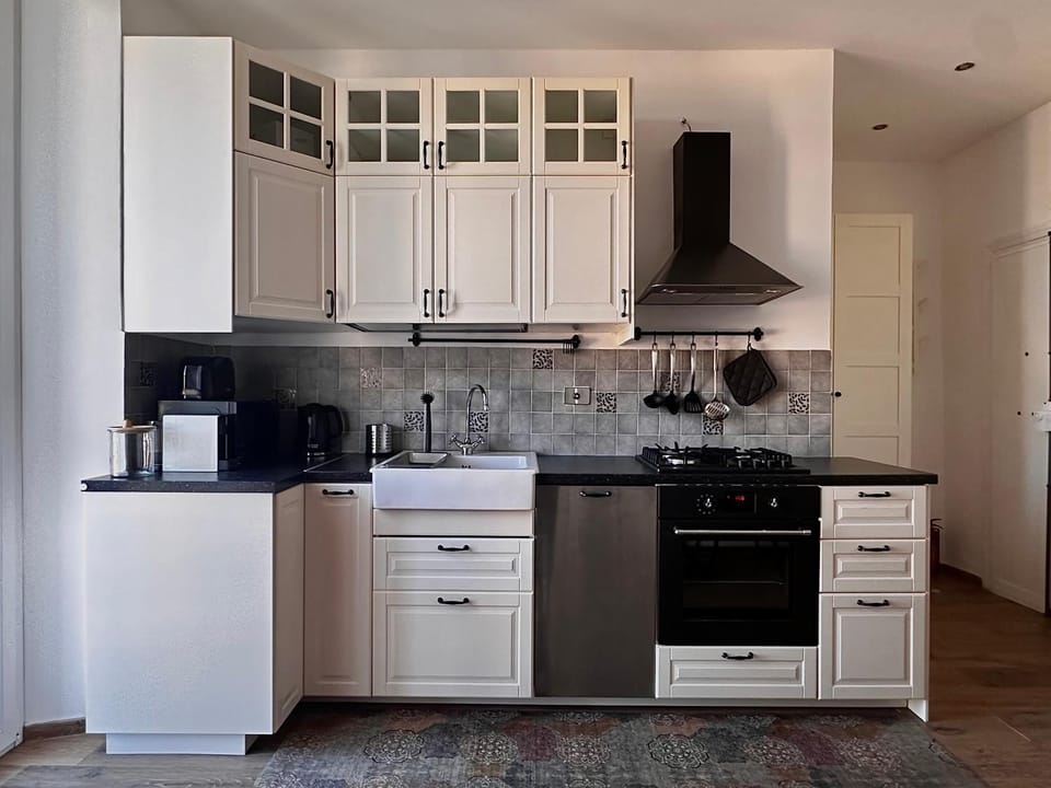 Kitchen or kitchenette, dishwasher, microwave, oven