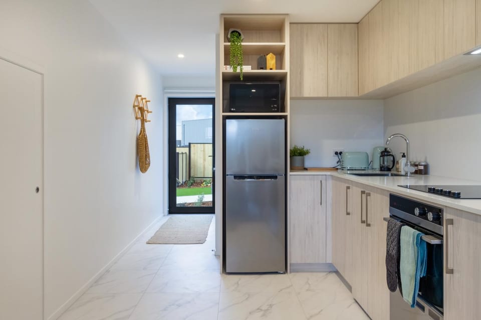 Kitchen or kitchenette, dishwasher, oven, stove