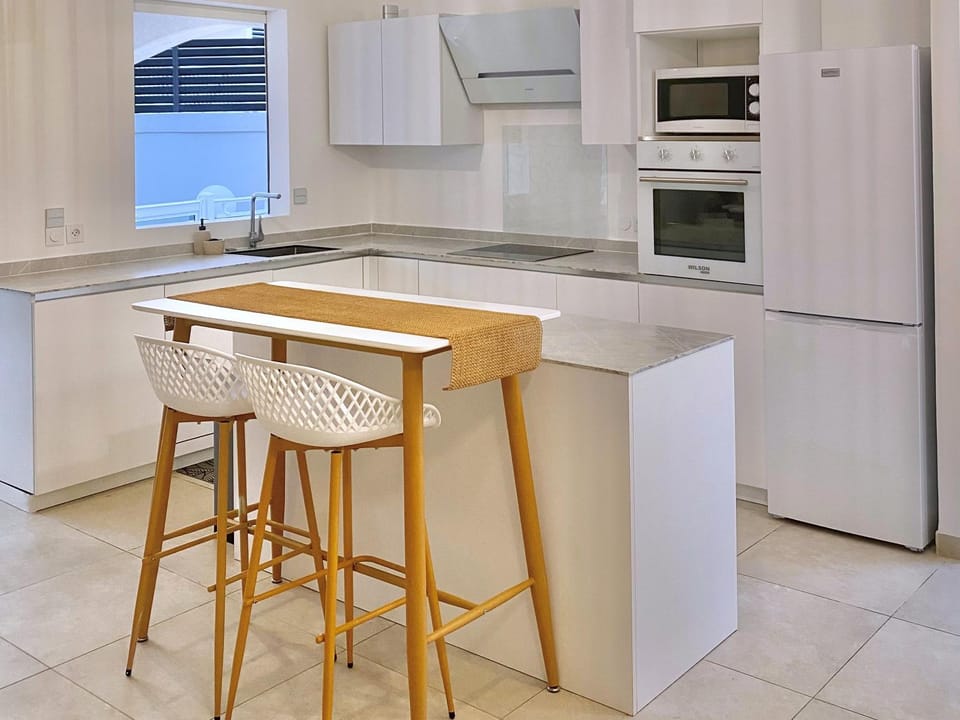 Kitchen or kitchenette, dishwasher, microwave, oven