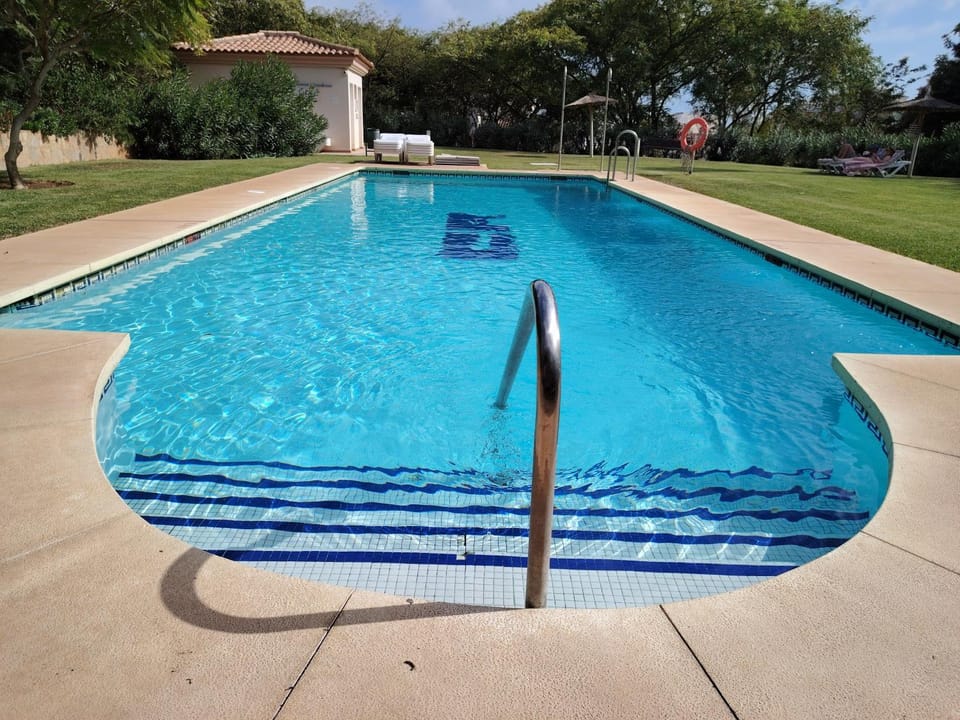 Swimming pool, sunbed