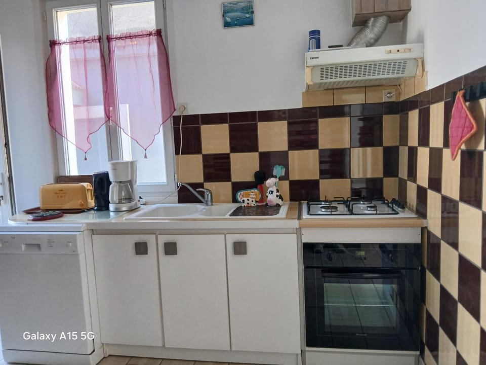 Kitchen or kitchenette, stove, toaster