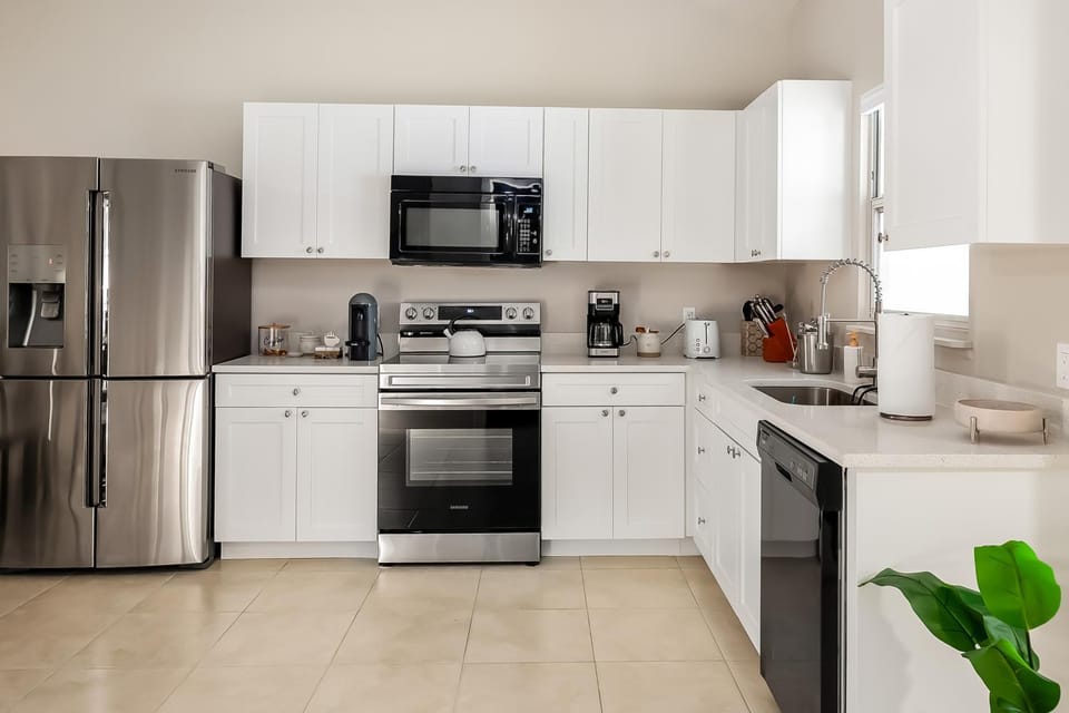 Kitchen or kitchenette, dishwasher, oven, stove