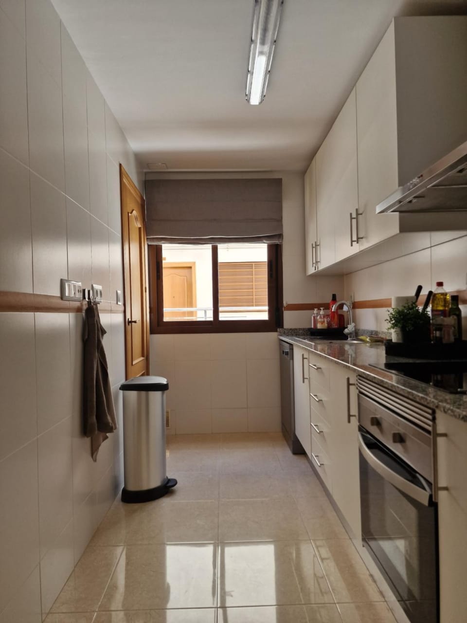 Kitchen or kitchenette, dishwasher, oven, stove
