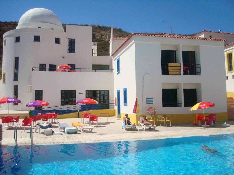 Property building, Patio, Pool view, Swimming pool, sunbed