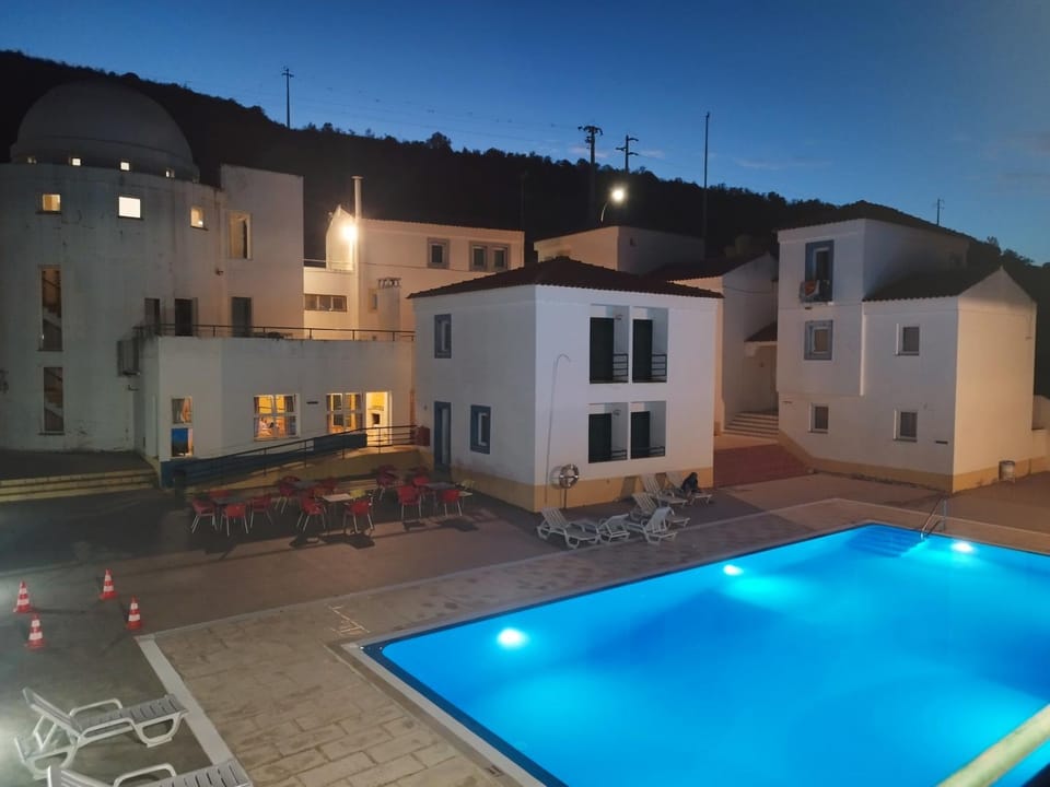 Property building, Patio, Night, Pool view, Swimming pool, sunbed